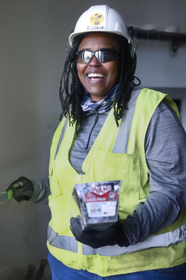 Black woman laborer painting